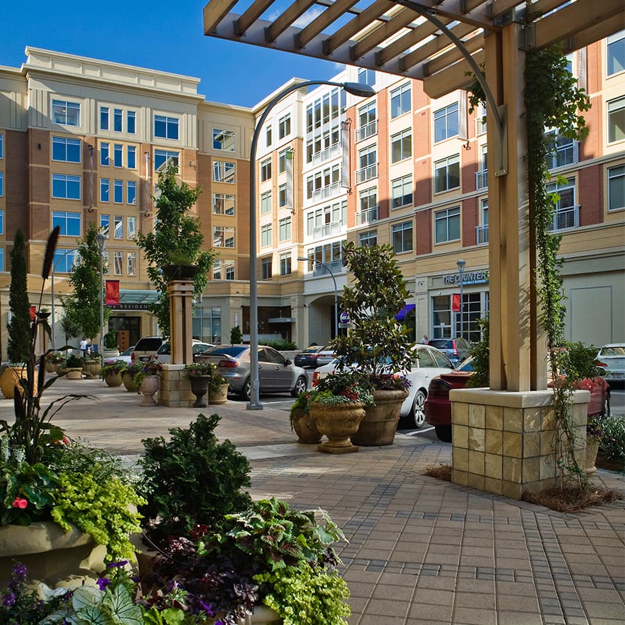 A pedestrian walks through Town Brookhaven, a mixed-use